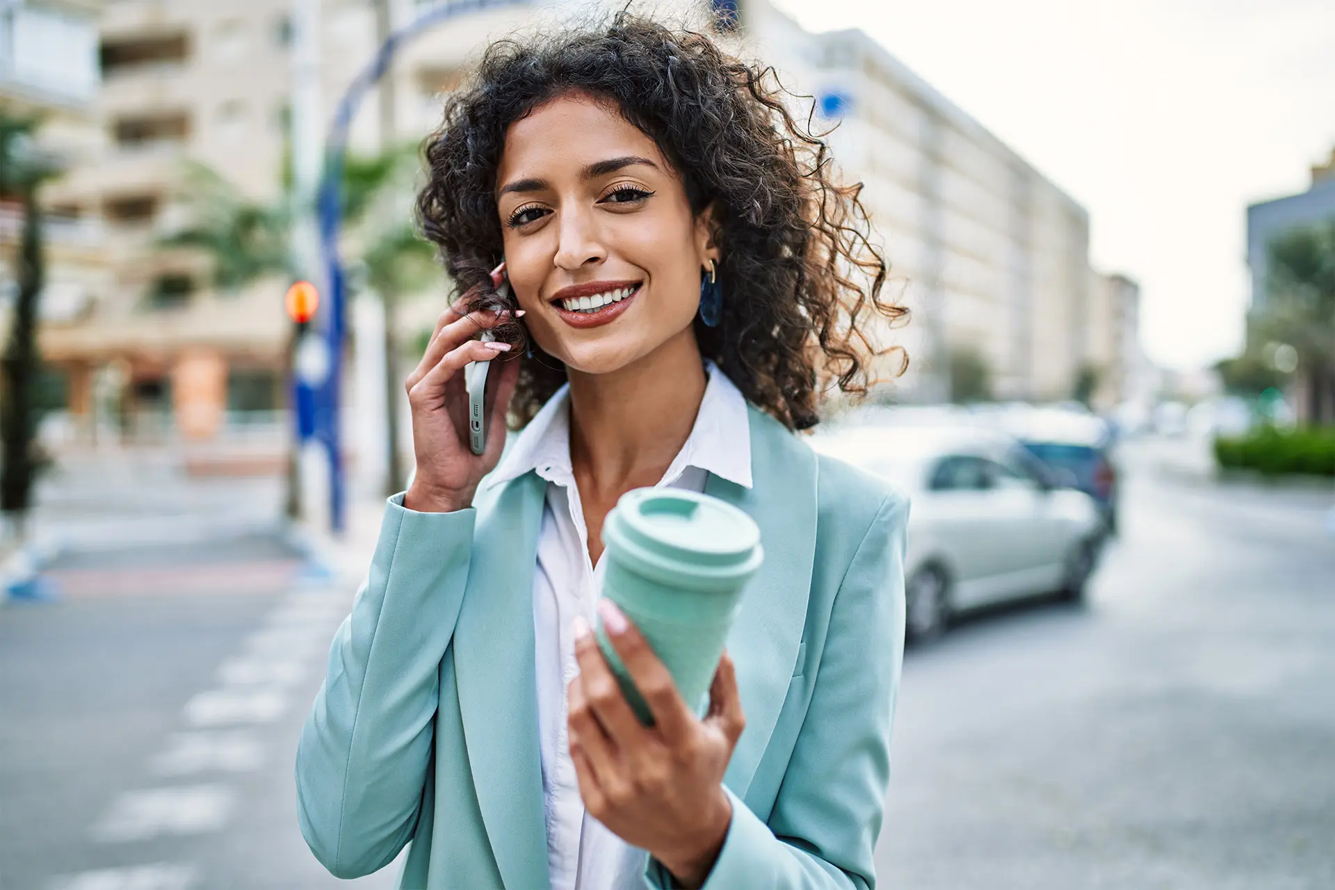 Seattle professional on a phone call outside, discussing next steps after the USCIS adjustment of status memo
