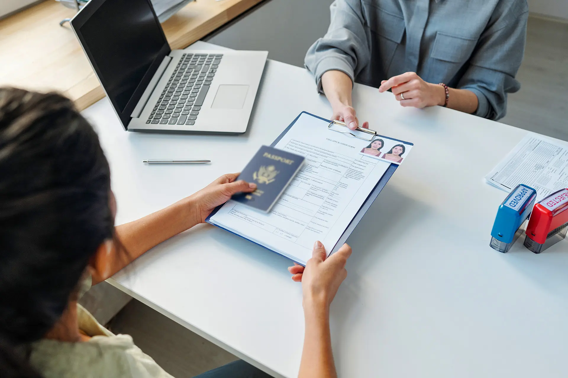 H-1B visa petition documents on an attorney's desk