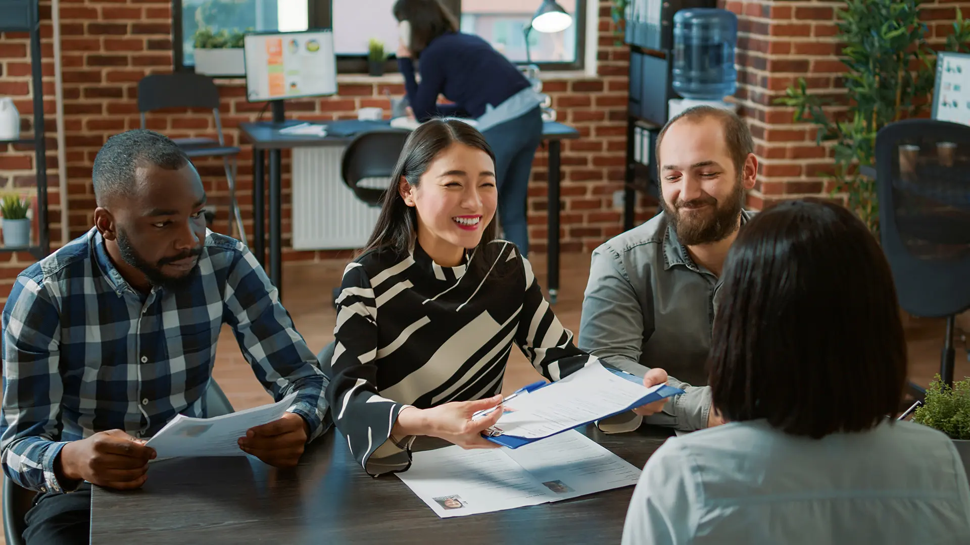 Employer team collaborating on international hiring strategy